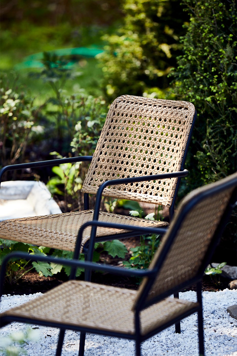 two rattan chairs on patio