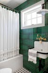 Emerald green bathroom with vintage sink