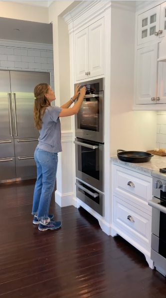 Jennifer garner opening oven in kitchen