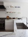 white kitchen marble countertops and open shelving