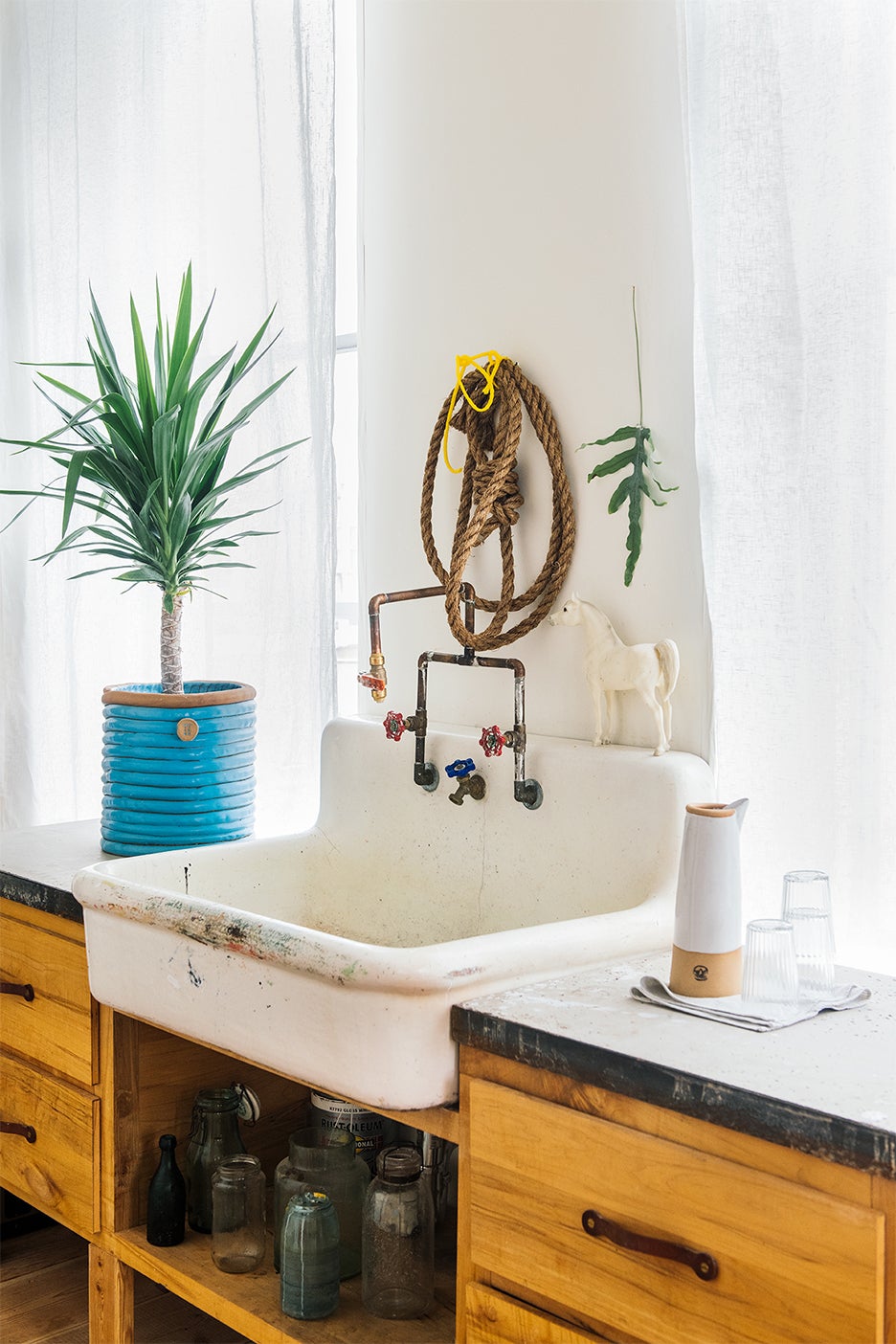 rustic sink with open cabinet