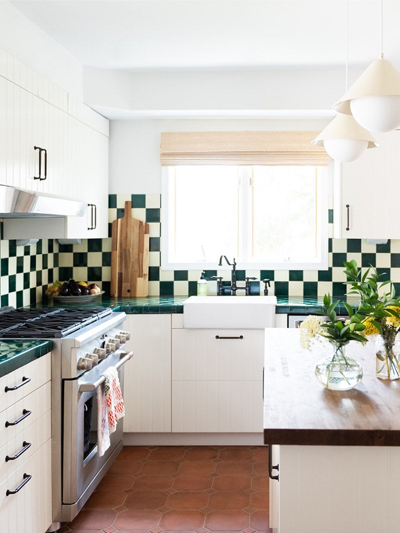 green kitchen with tiled counters
