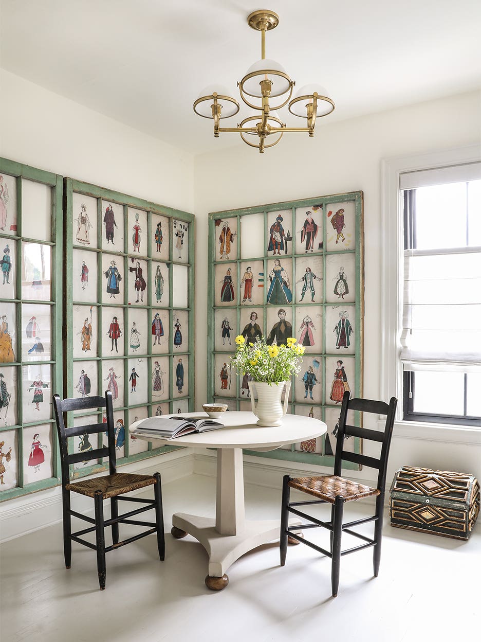 dining room with green windows and white table