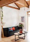 minimalist living room with expsoed beams