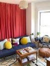 Living room with red curtain