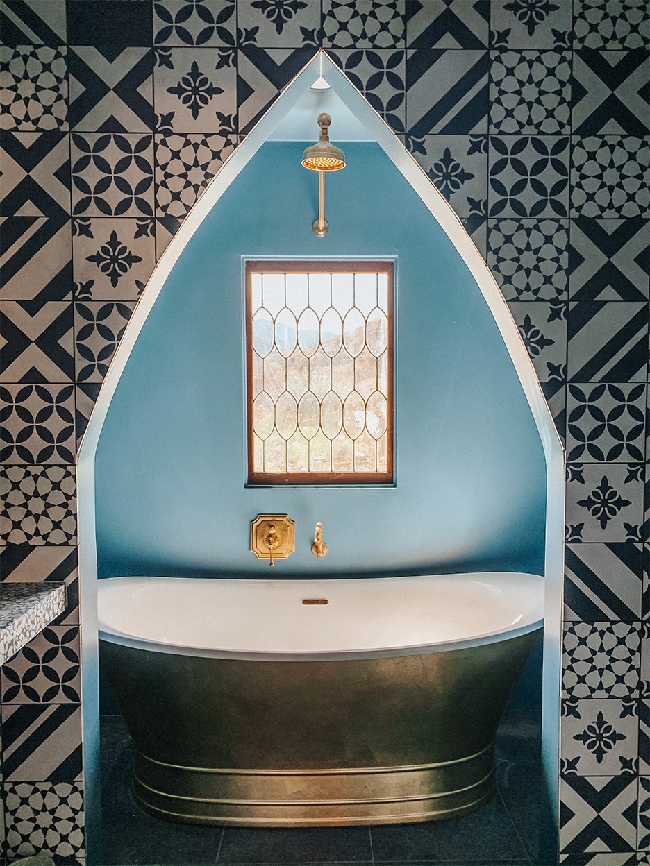 blue bathroom with pointed arch