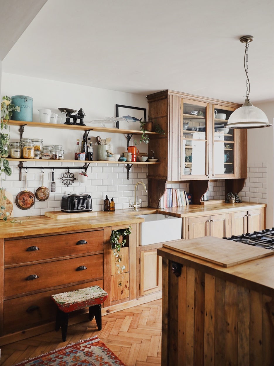 antique wood kitchen with subway tiles