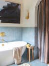 blue zellige tile bathroom with standalone tub