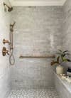 grey shower nook with marble tile