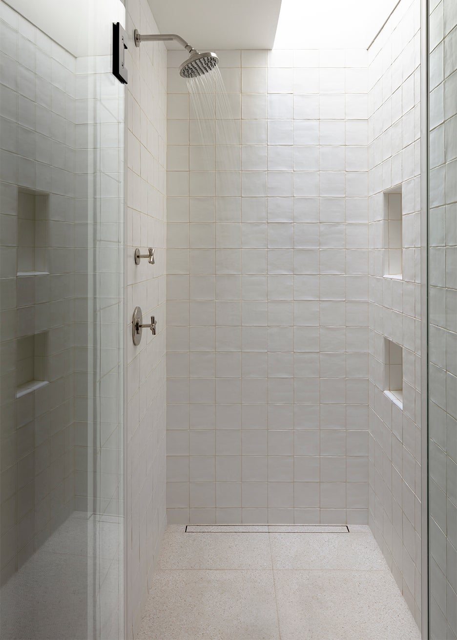 White custom shower with skylight
