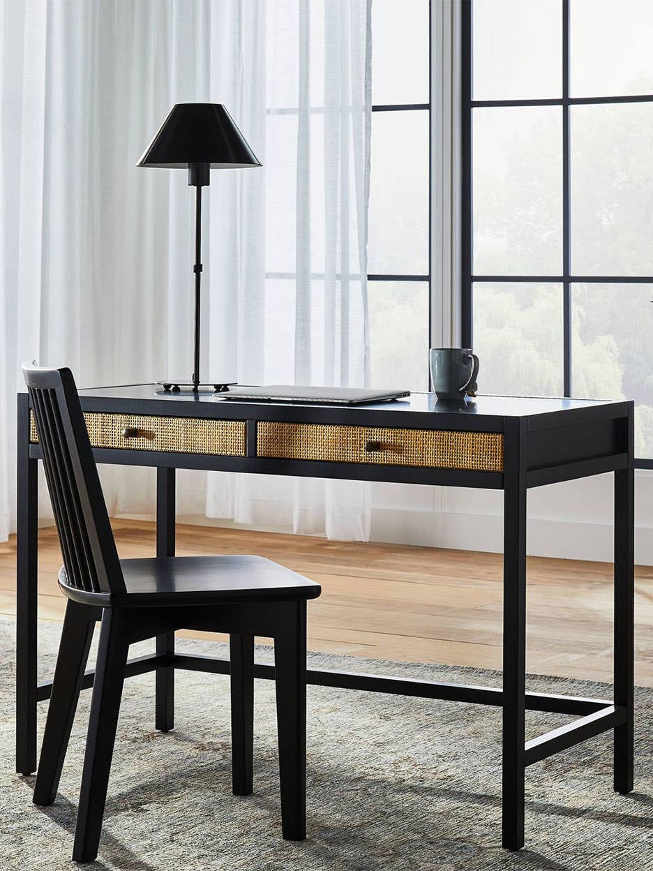 black cane desk with black chair