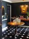 dark blue foyer with black and white checkerboard tiles