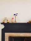 black mantel with vases and bookends
