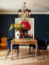 dark blue dining room with wooden table