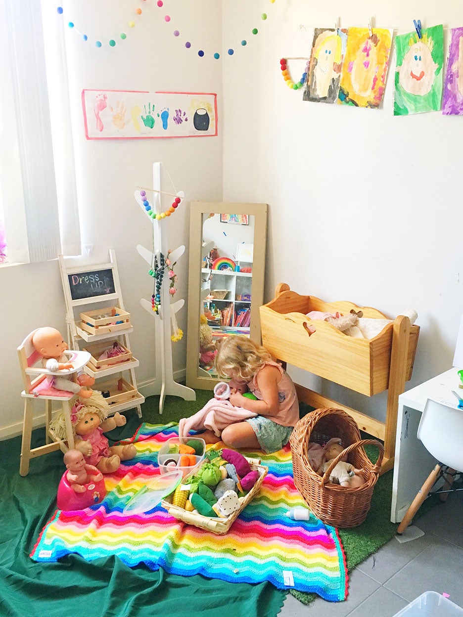 girl playing in colorful nursery