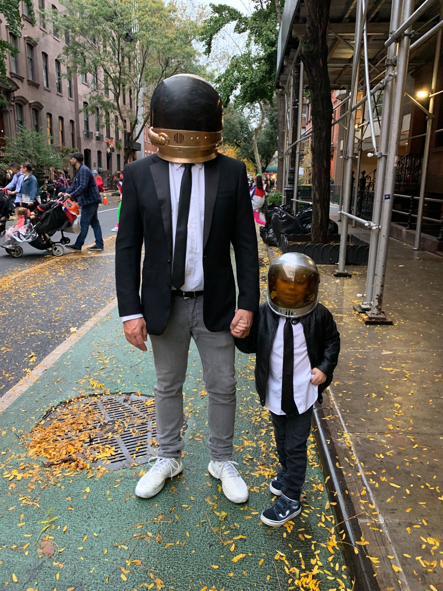 father and son in daft punk outfit