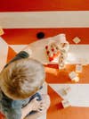 boy playing with blocks on floor
