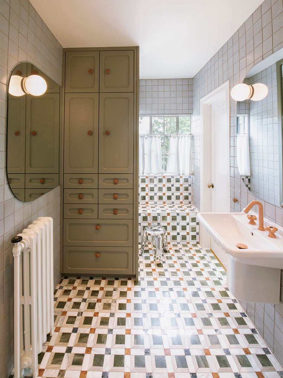 Bathroom with mosaic floor tile and terra cotta faucets