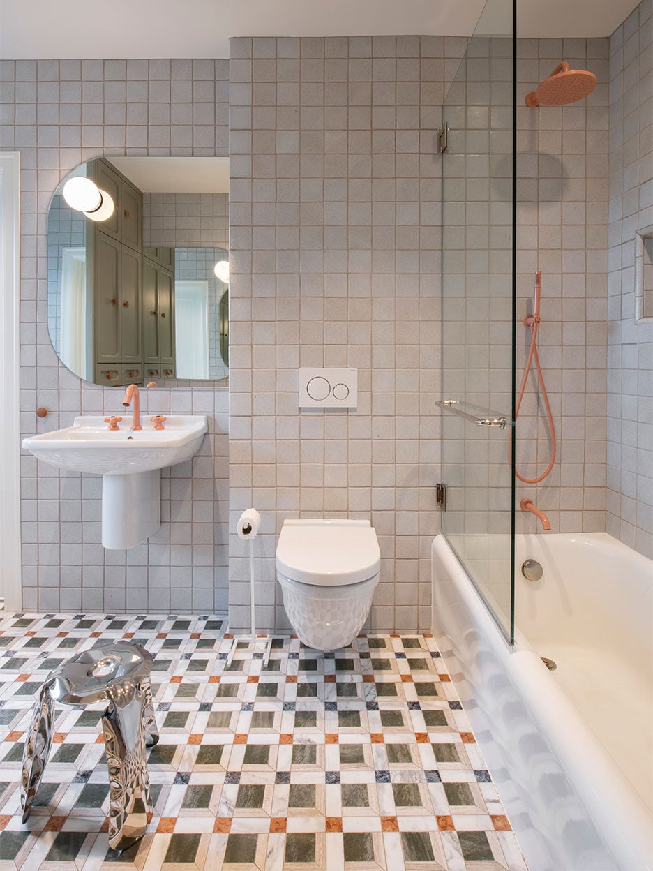 Bathroom with mosaic tile and terra cotta faucets