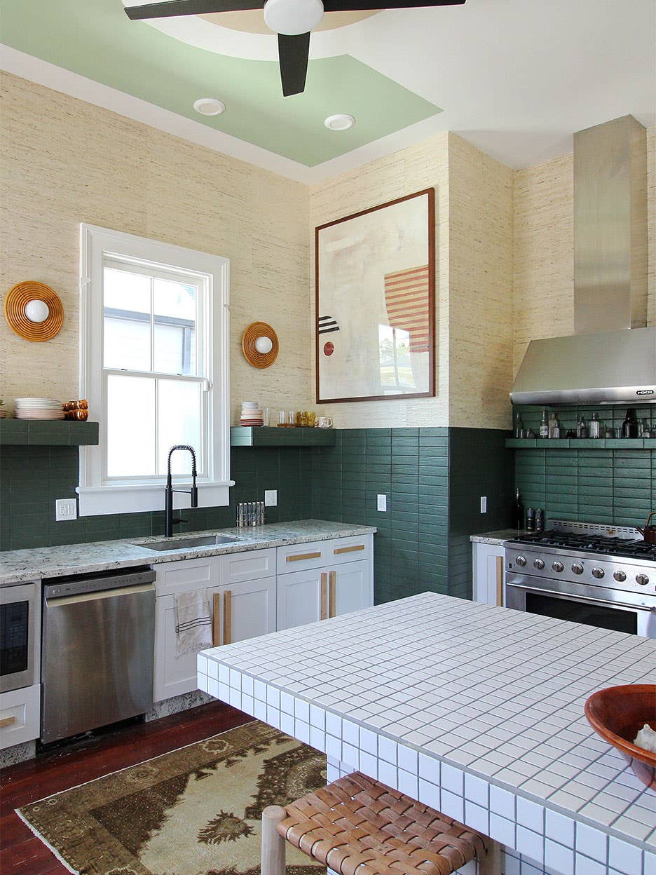 Kitchen with green tile and grasscloth wallpaper