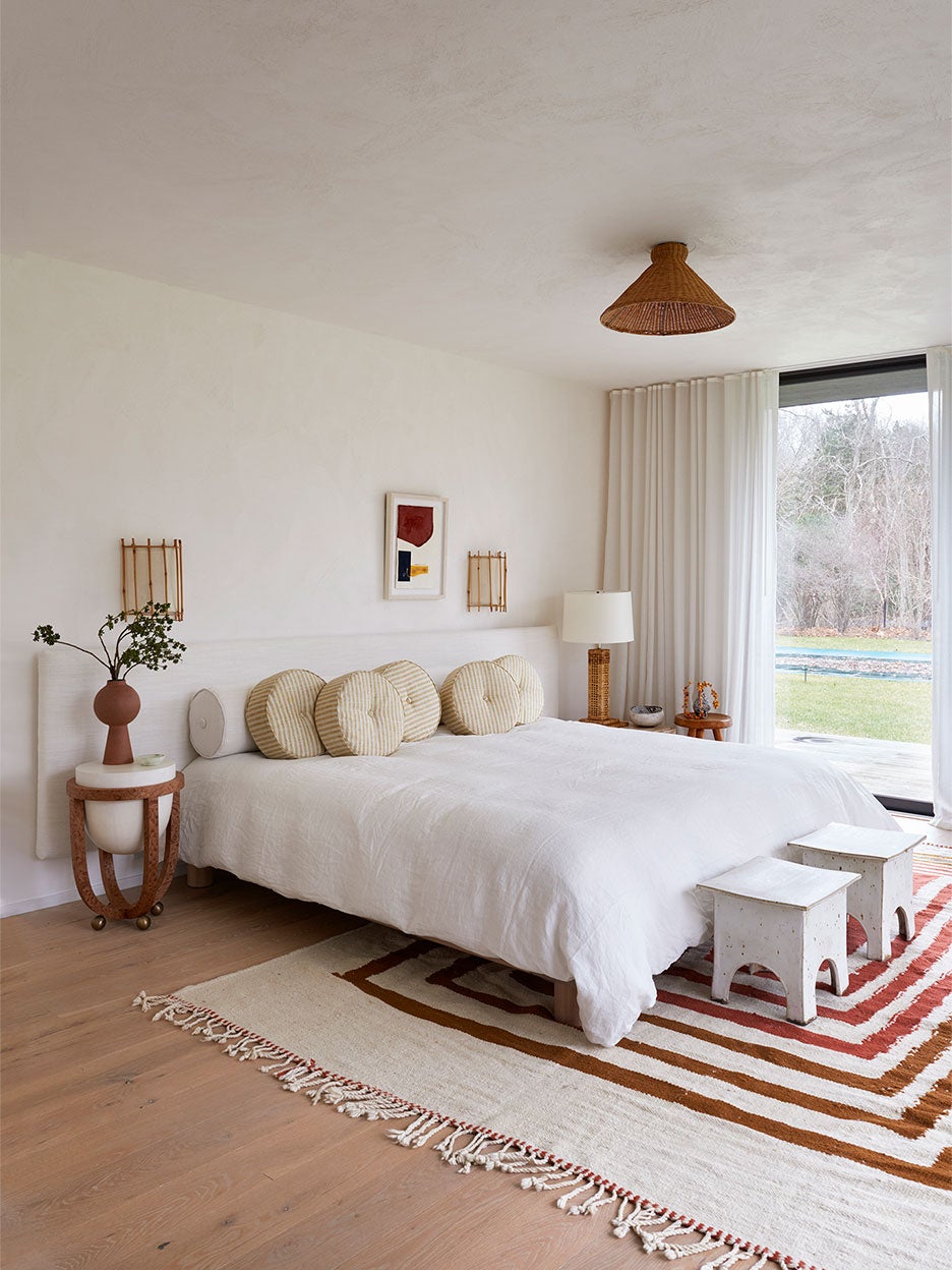 red and brown striped rug in a bedroom