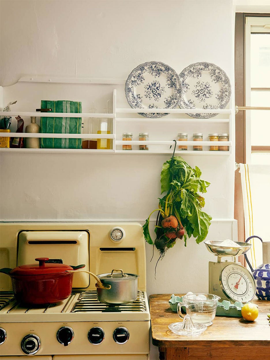 vintage kitchen with yellow stove and open shelving
