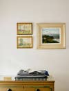 vignette with picture frames hanging on wall