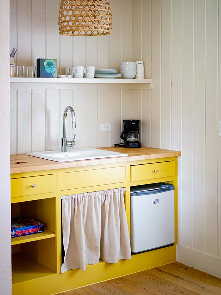 yellow kitchen with sink skirt