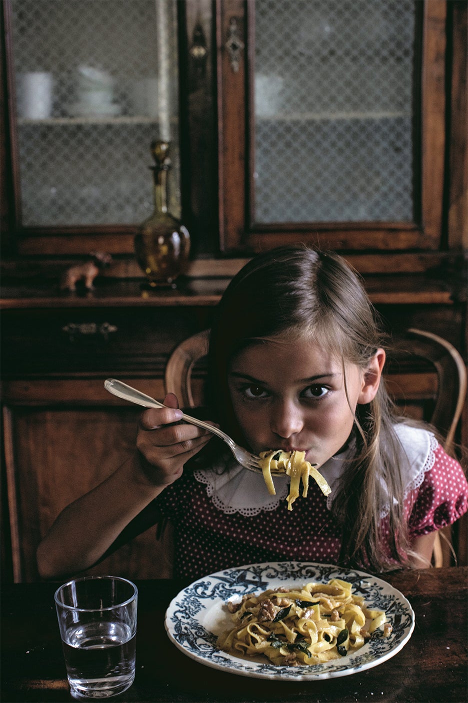 girl eating pasta