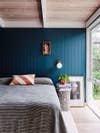 Teal blue bedroom with concrete table