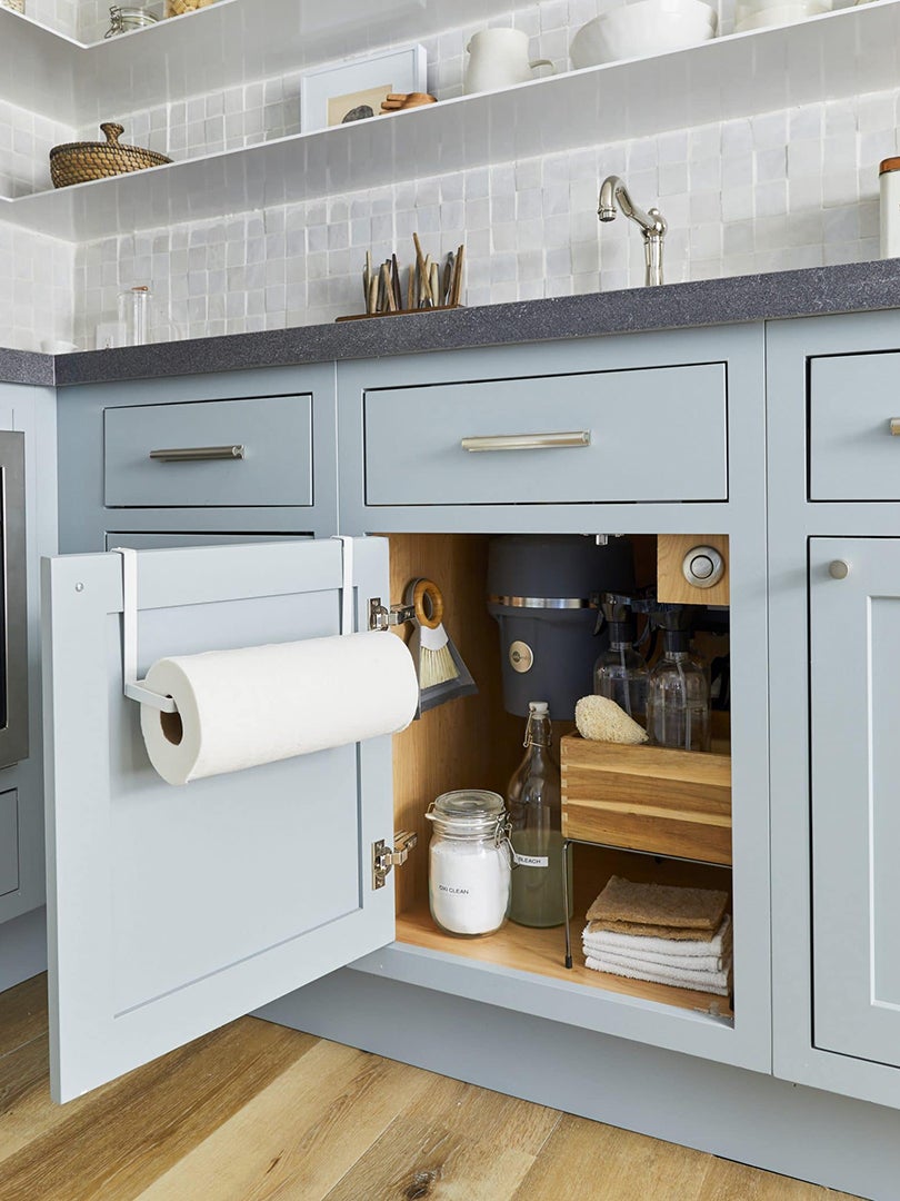 light blue kitchen cabinets with paper towel roller
