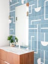 bathroom with blue geometric tile backsplash