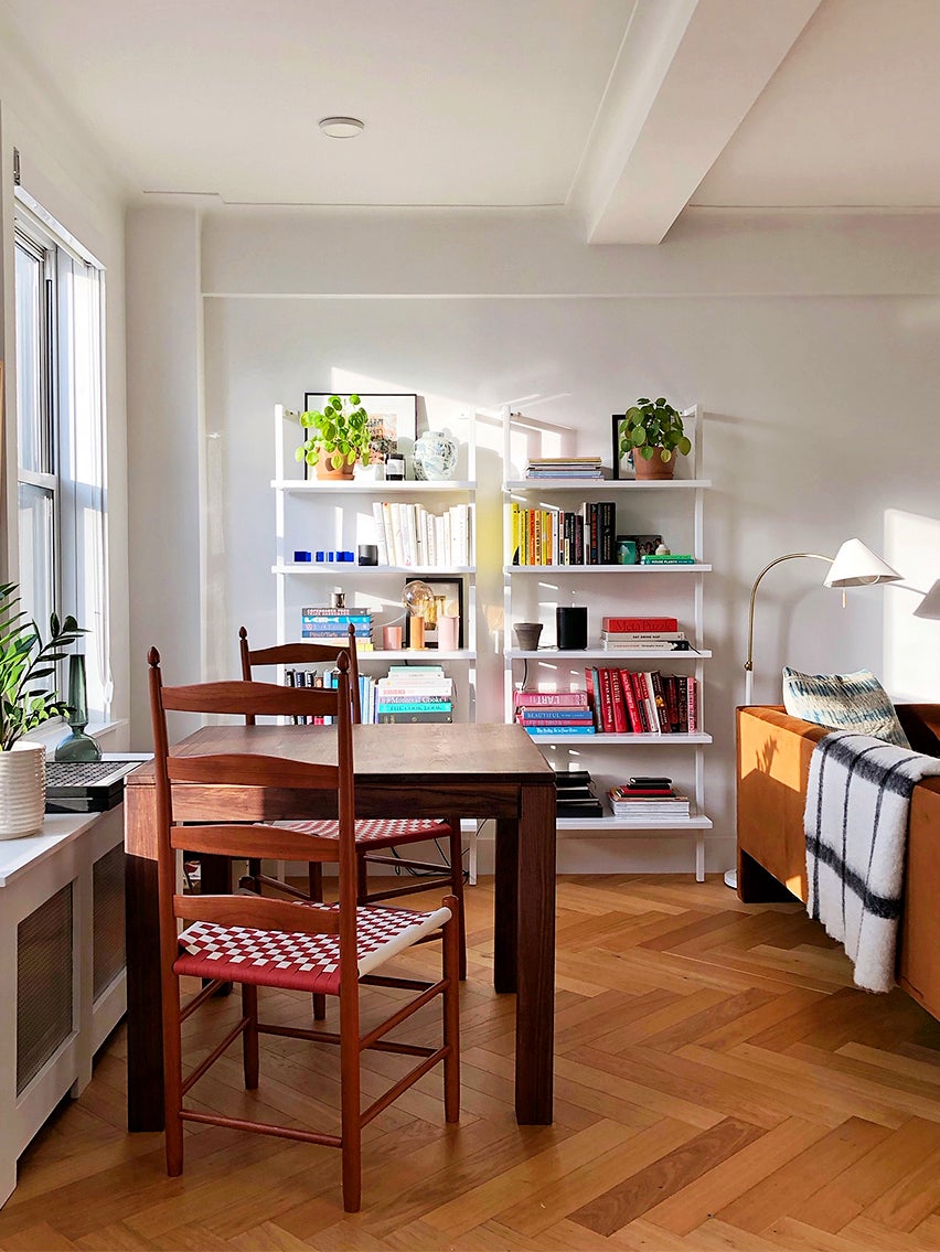 Small space dining area with bookcase