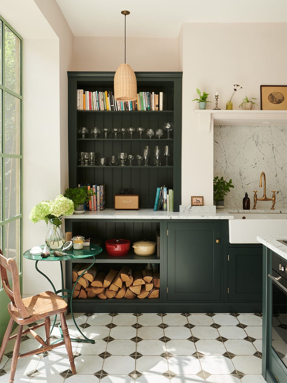 green kitchen with black and white floors