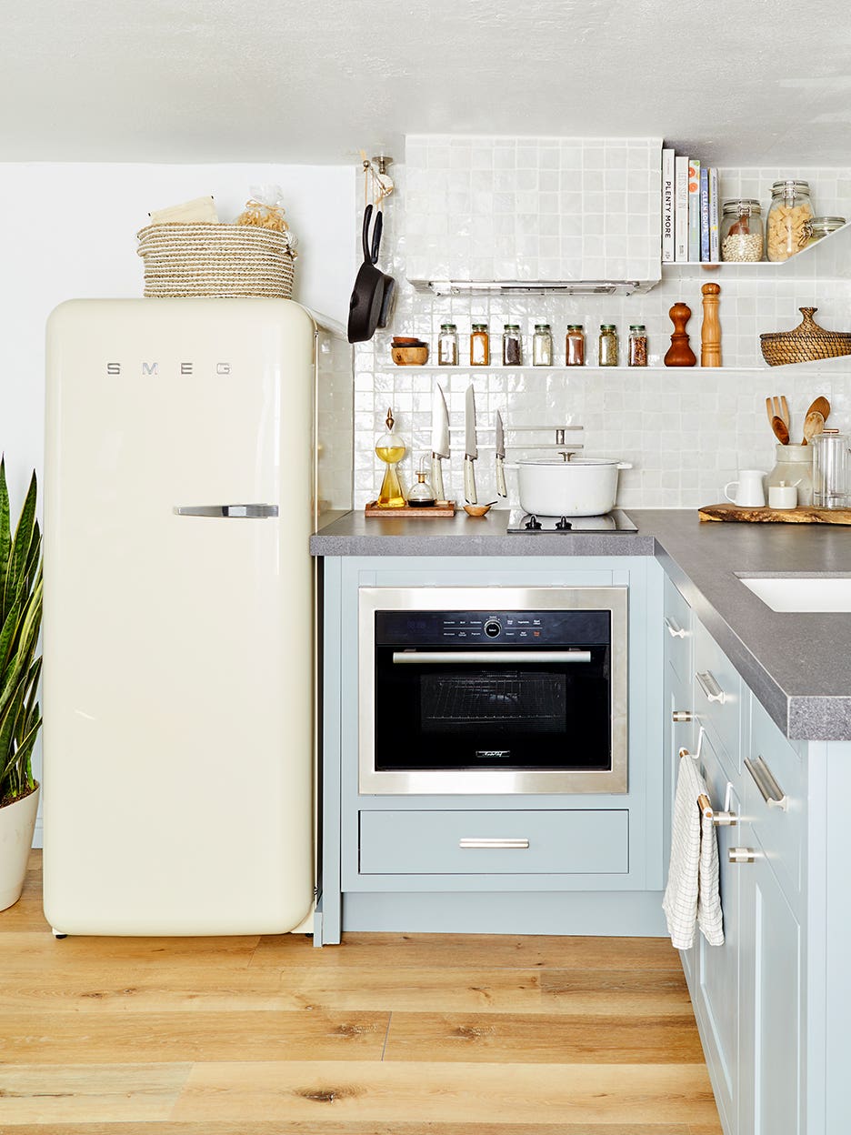 white fridge in a blue kitchen