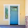 yellow home with blue door
