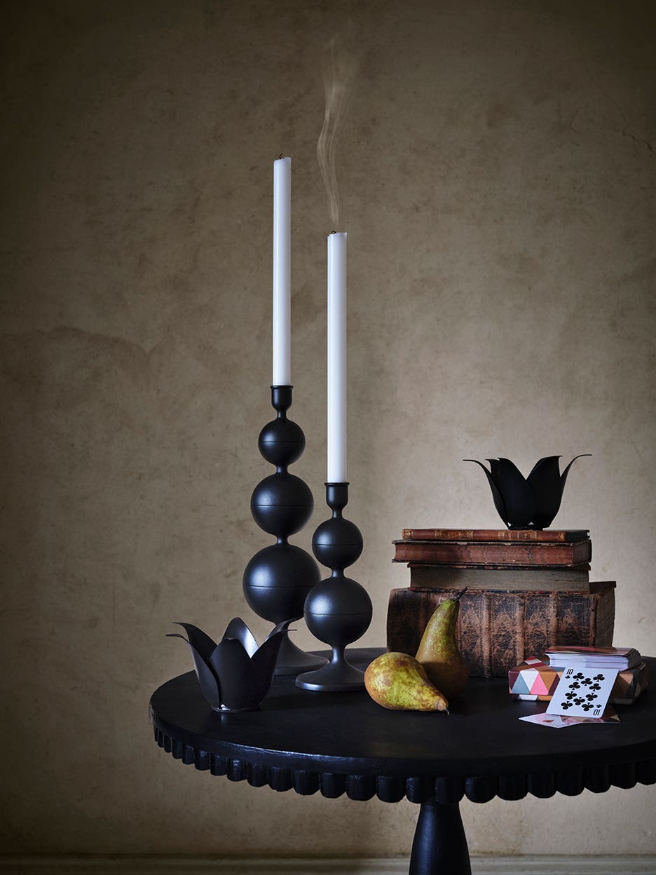 black candles on a table