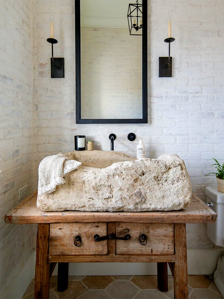 large white stone sink on wood table
