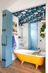 orang tub in blue bathroom