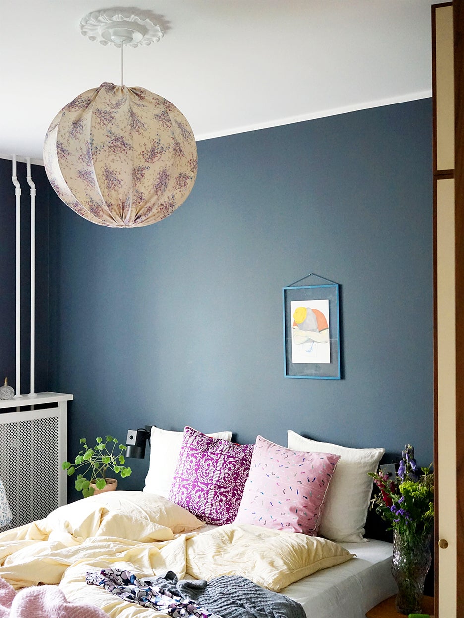 bedroom with blue accent wall