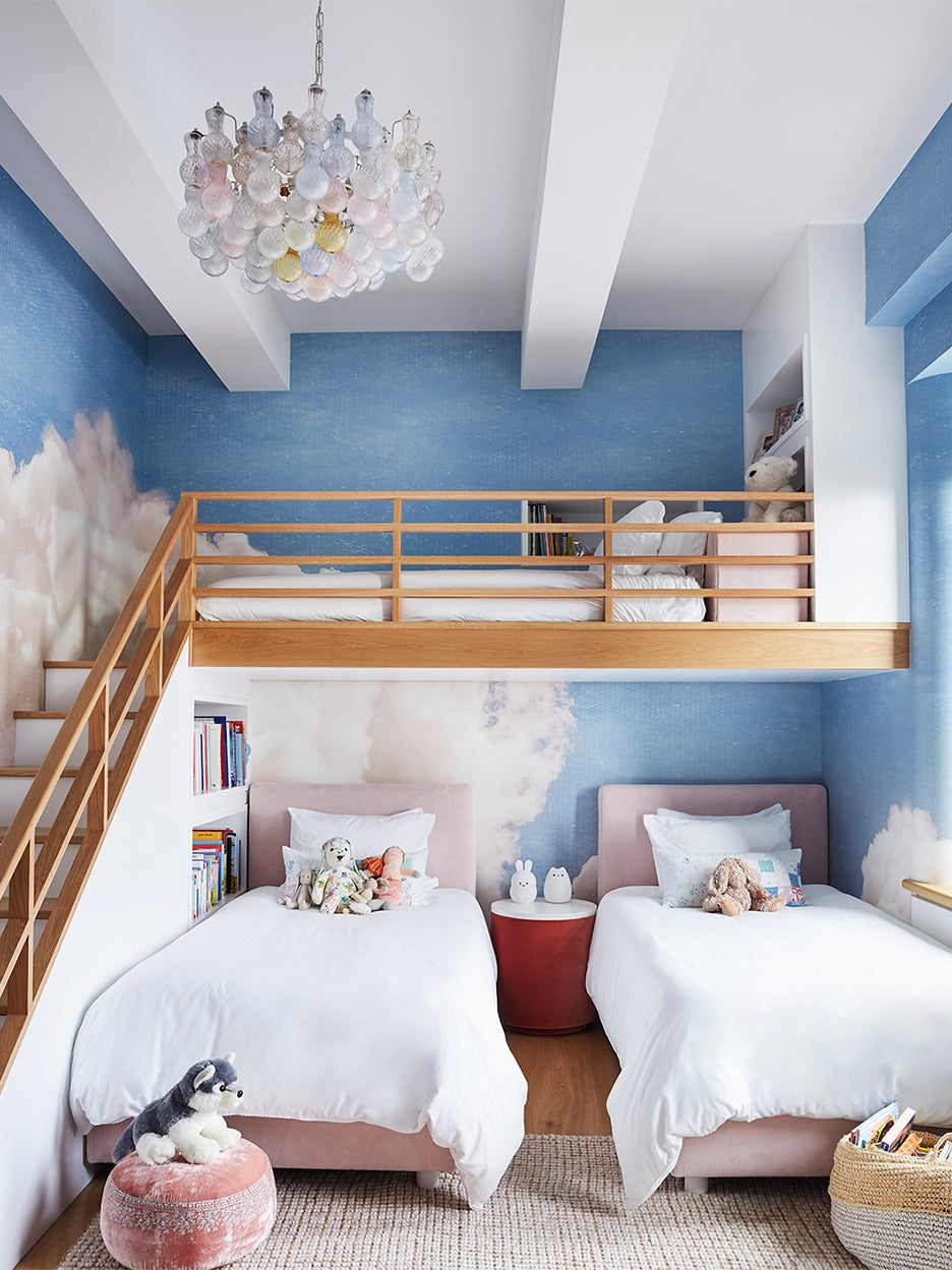 shared kids' room with cloud wallpaper