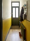 Yellow hallway with dado rails