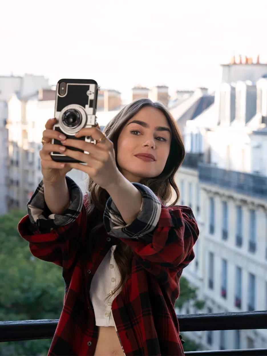 Woman taking selfie in Paris