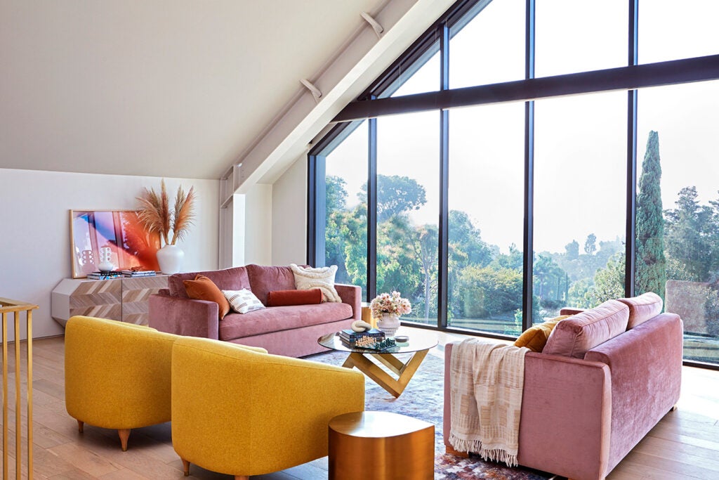 living room with pink sofas