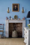 Marble fireplace in blue bedroom
