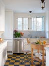 White kitchen with blue and yellow checkered floors