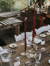 Dinner table with red taper candles