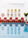 Indoor pool with red chairs