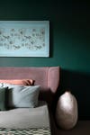green bedroom with blush pink headboard