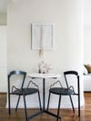 marble bistro table with black chairs
